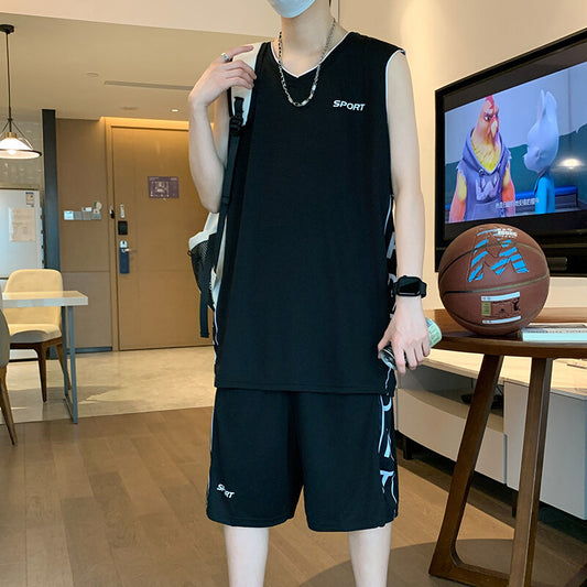 Person wearing a black sleeveless shirt and shorts set with a TV in the background displaying a cartoon show.
