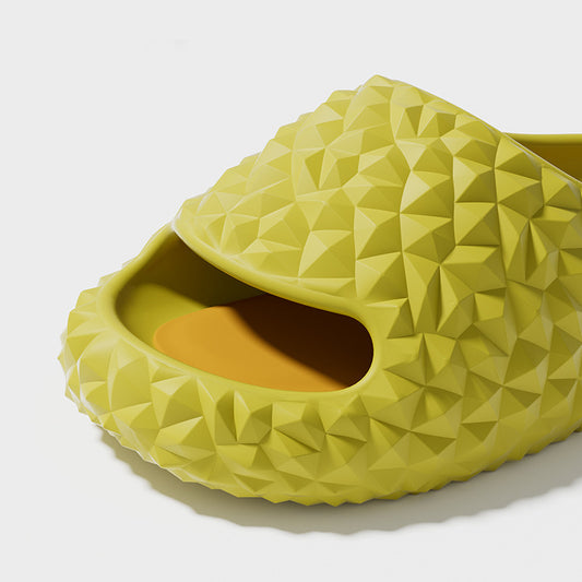 Green textured slide sandal on a white background