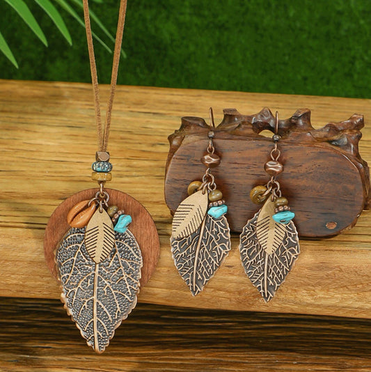 Necklace with leaf pendants on a wooden surface