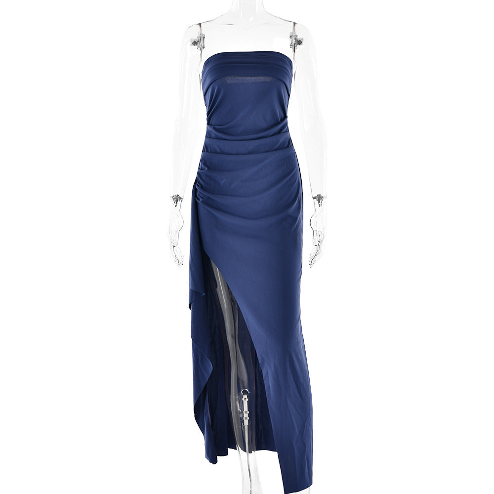 Navy blue strapless gown on a mannequin against a white background