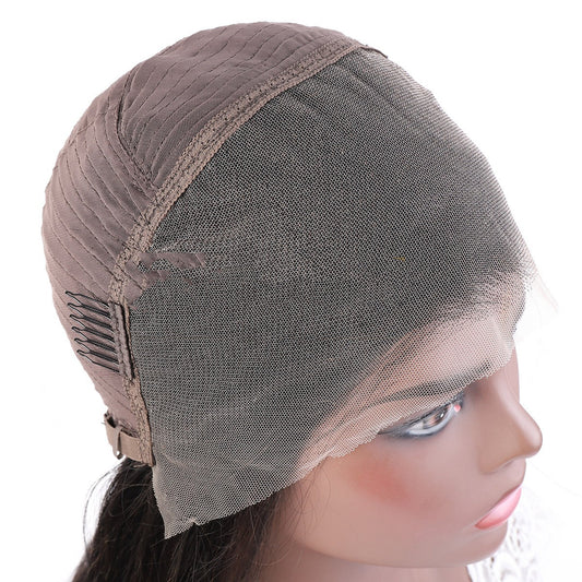 Wig cap on a mannequin head with a white background