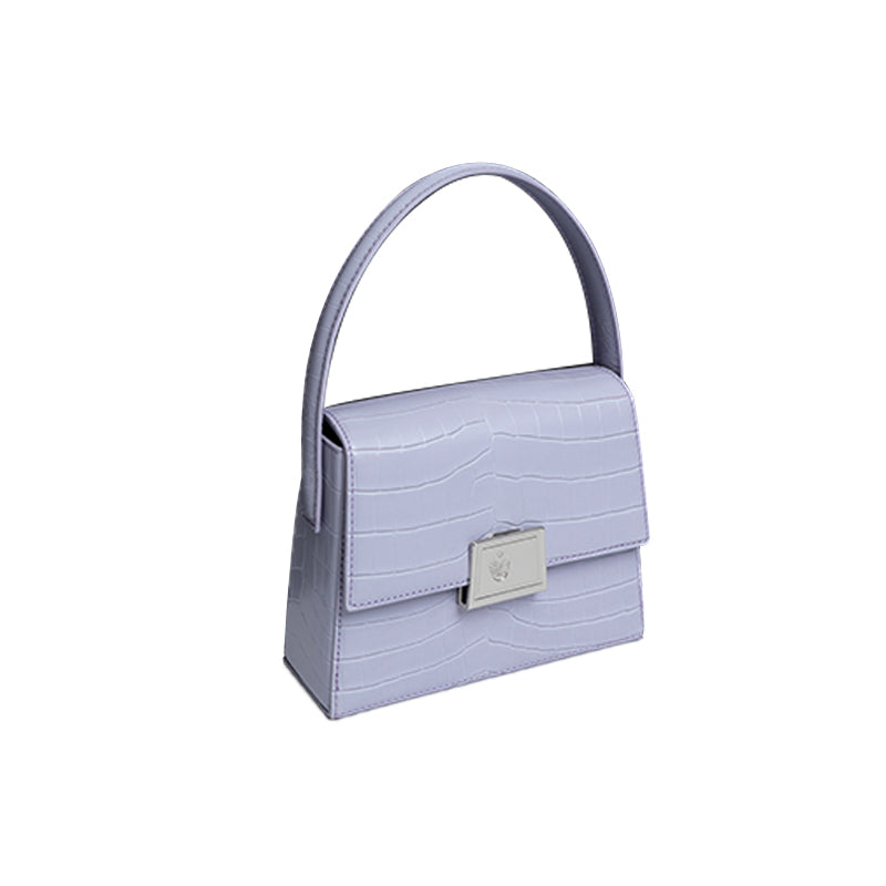 Light purple handbag with a silver clasp on a white background