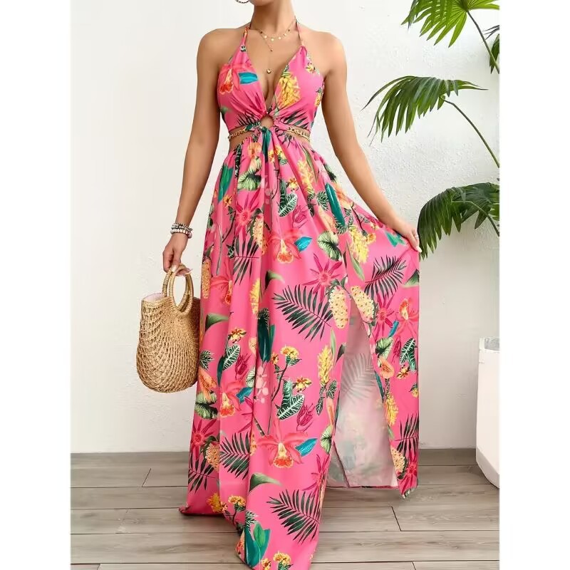 Woman wearing a pink floral dress holding a straw bag indoors.