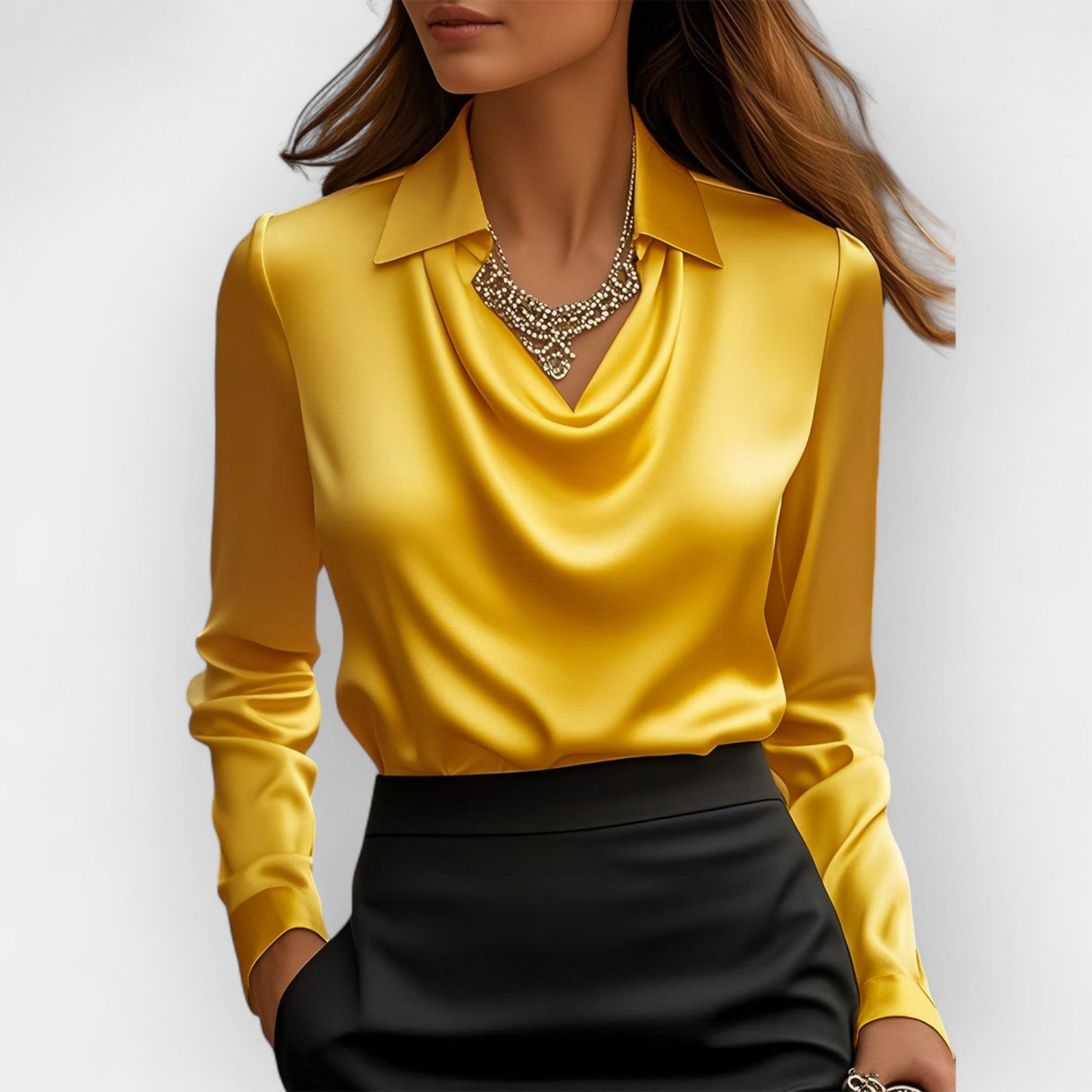 Yellow long-sleeve top worn by a person on a plain background