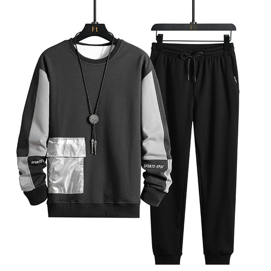 Black and gray tracksuit with metallic panel on a white background