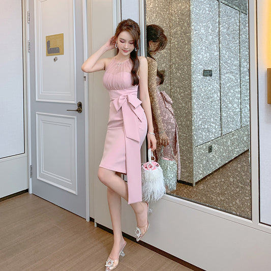 Woman in a pink dress standing in front of a mirror, holding a handbag. by millivan