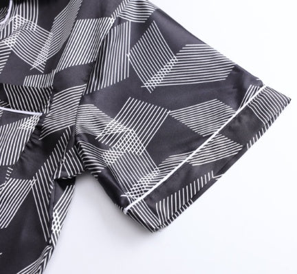 Black fabric with white geometric pattern on a white background