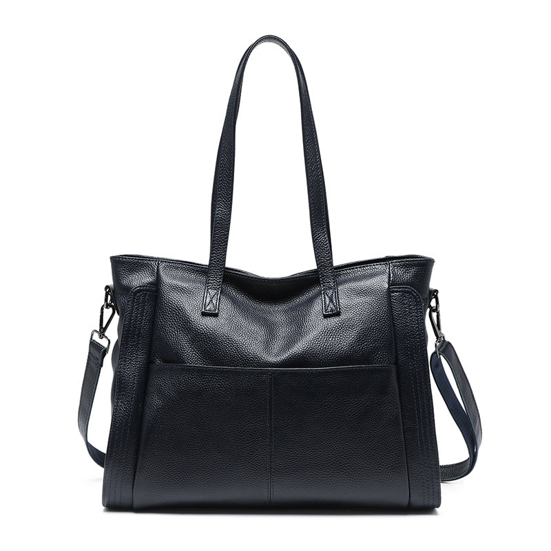 Black leather handbag on a white background