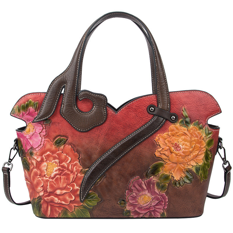 Handbag with floral designs on a white background