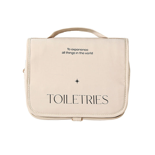 Beige toiletries bag with 'TOILETRES' text on a white background