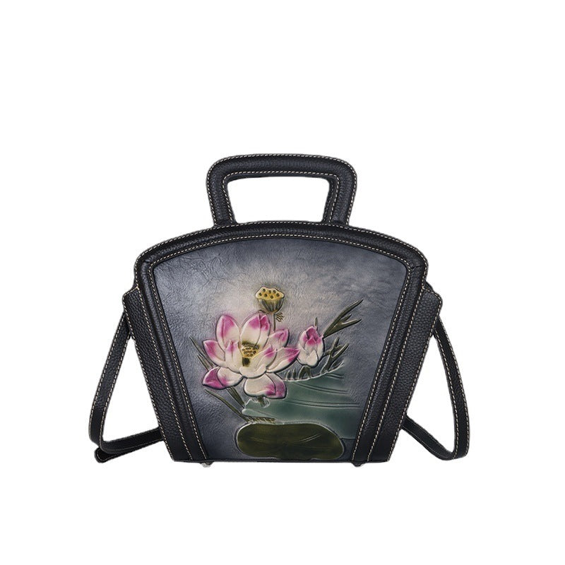 Handbag with floral design on a white background