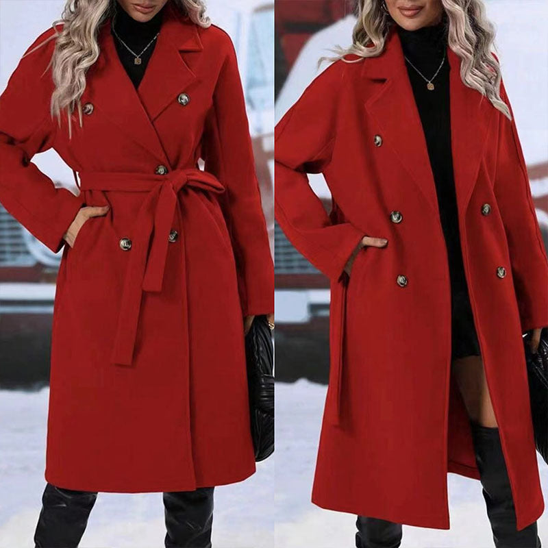Red coat worn by a person with a blurred snowy background