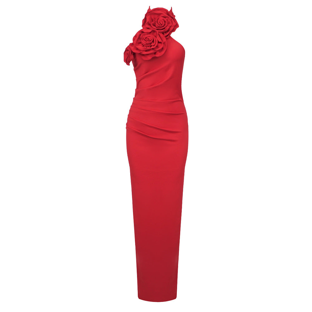 Red evening gown with floral design on a white background