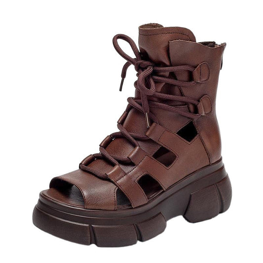 Brown leather platform boot with cut-out design on a white background