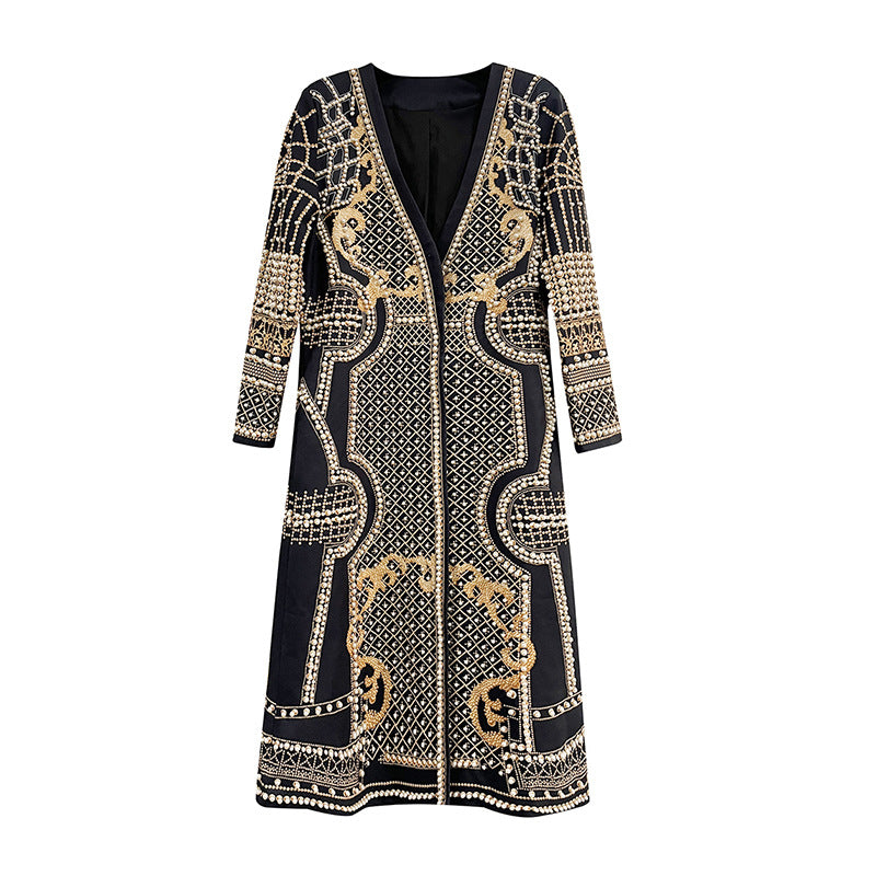 A long-sleeve open-front cardigan dress featuring an intricate black and beige paisley and geometric pattern, displayed on a clean white background.