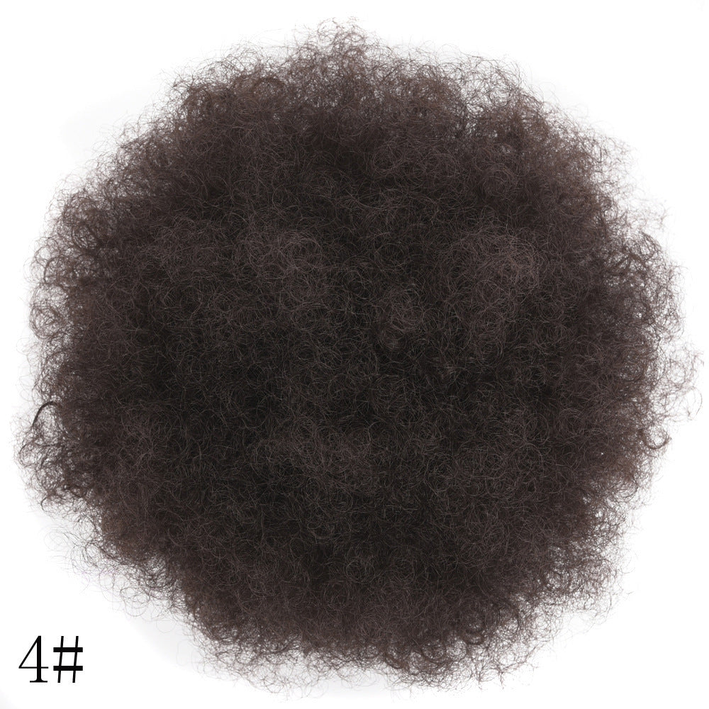 Clump of dark brown hair on a white background