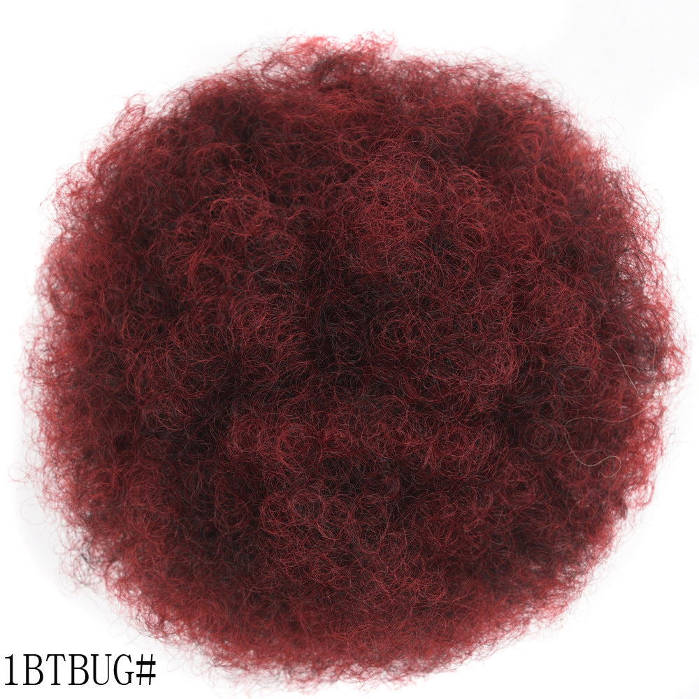 Reddish-brown hair bun on a white background