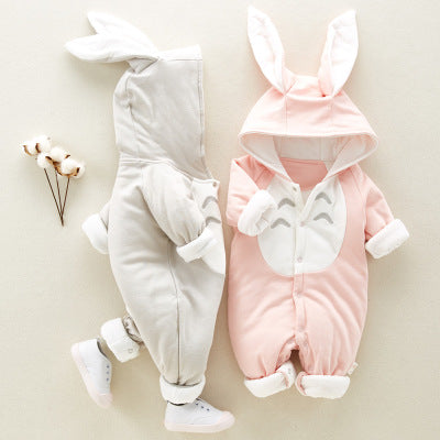 Two baby rompers with bunny ears, one gray and one pink, on a light background.