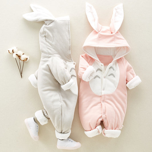 Two baby rompers with bunny ears, one gray and one pink, on a light background.