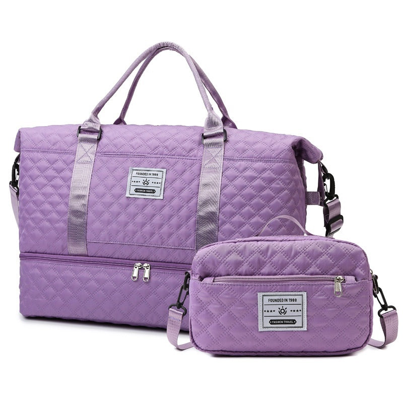 Purple quilted travel bag with a smaller matching pouch on a white background