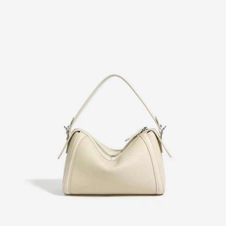 Beige handbag on a light gray background