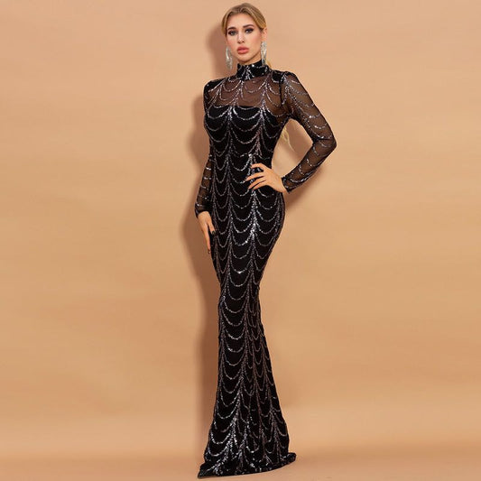 Black sequin evening gown on a model against a beige background