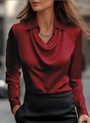 Red blouse worn by a person with a blurred background