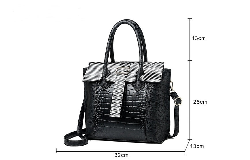 Black handbag with measurements on a white background