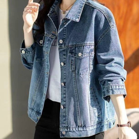 Denim jacket worn by a person with a blurred background