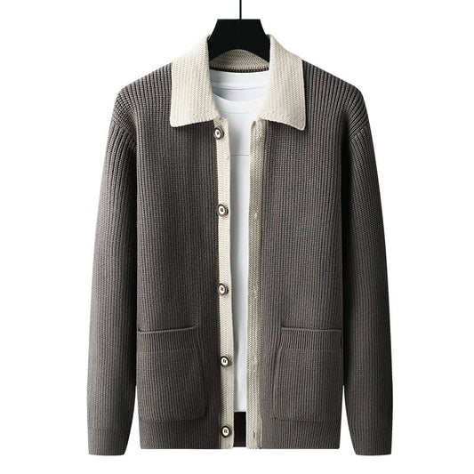 Gray sweater with white collar on a hanger against a white background