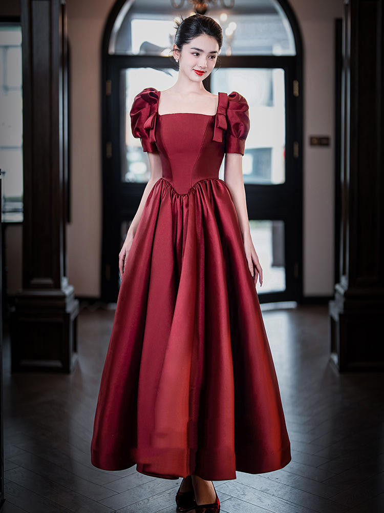Woman wearing a red dress in an indoor setting