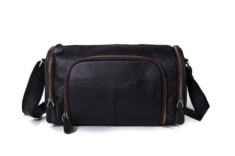 Black leather bag with multiple compartments on a white background