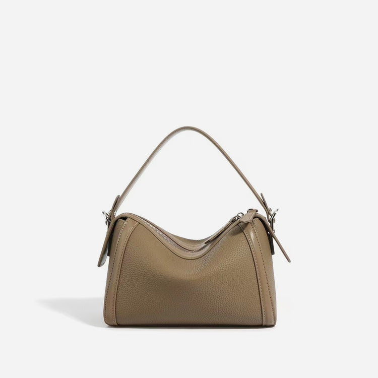 Beige handbag on a light gray background