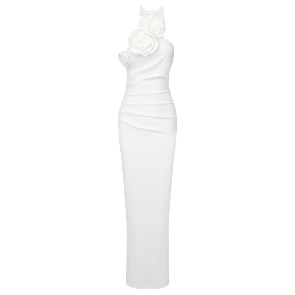 White one-shoulder dress with floral detail on a white background