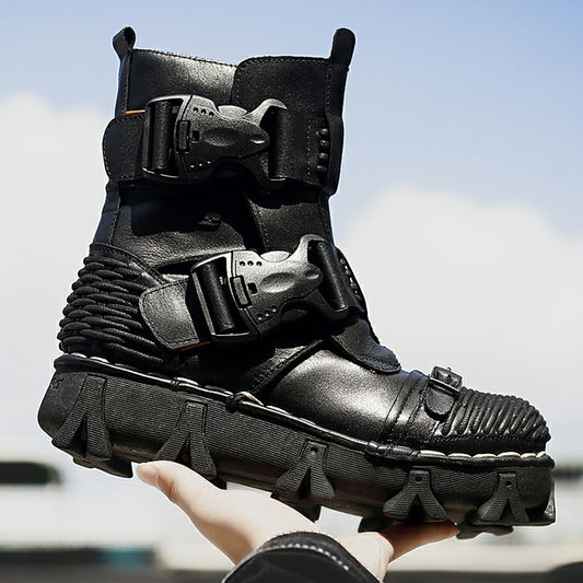 Black high-tech boot with multiple straps held by a hand against a blurred outdoor background