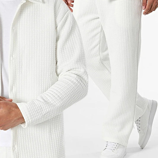 White textured sweater and pants with white sneakers on a light background