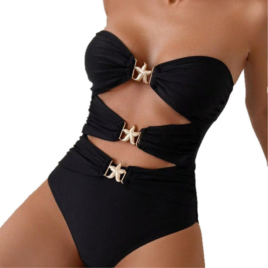 Black bikini with gold accents on a white background