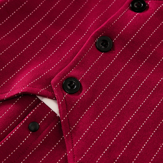 Close-up of a red pinstripe shirt with black buttons