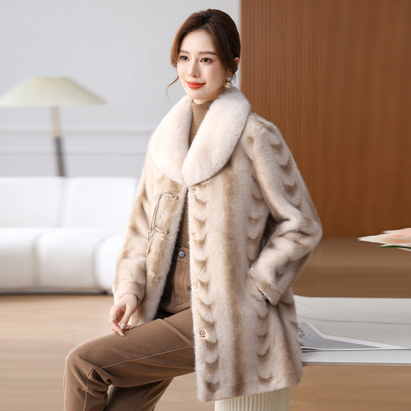 Woman wearing a beige coat with a fur collar in an indoor setting by millivan