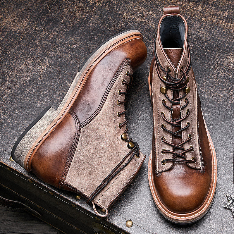 Pair of brown leather boots on a textured surface