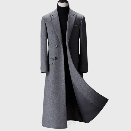 Gray overcoat on a mannequin against a white background