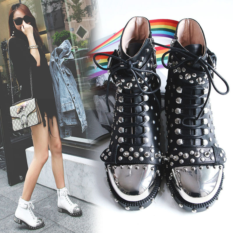 Black studded high-top sneakers with silver studs, displayed against a white background.