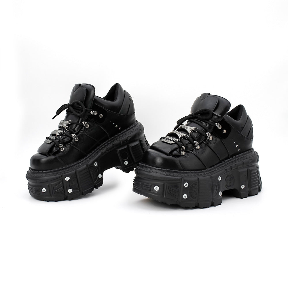 Black platform sneakers on a white background