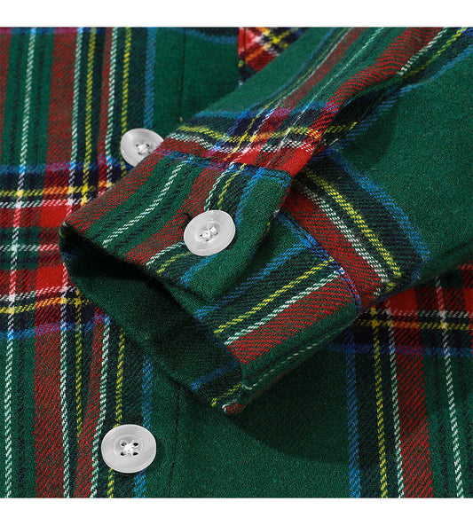 Close-up of a plaid shirt with green, red, and yellow colors.