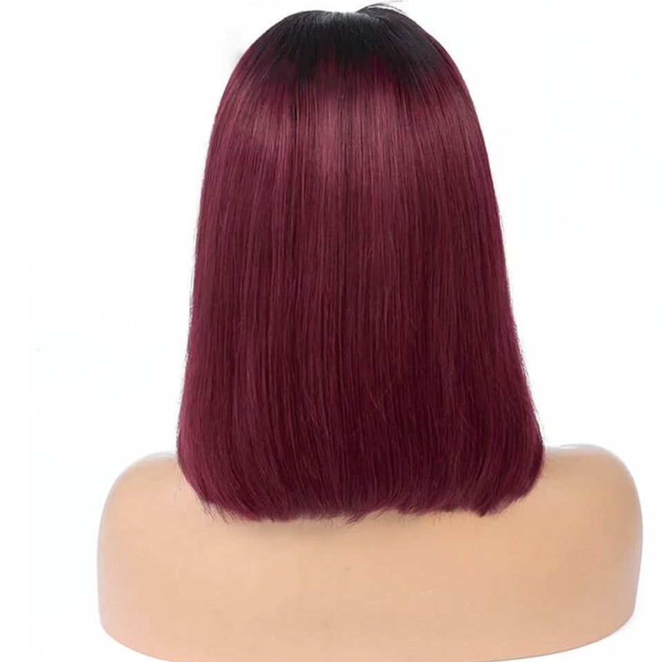 Burgundy and black ombre wig on a mannequin head against a white background