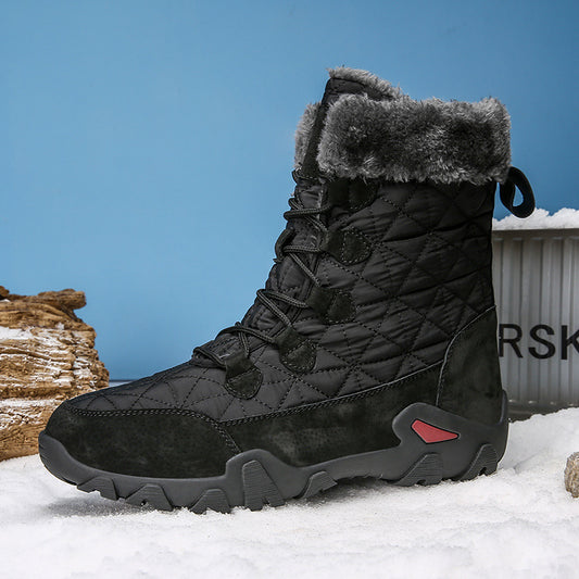 Black winter boot with gray fur lining on a snowy background