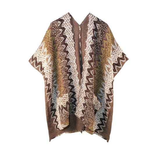 Patterned poncho with brown, beige, and black colors on a white background