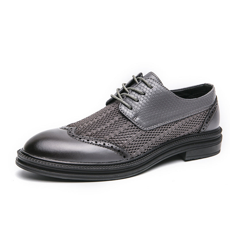 Gray and black dress shoe on a white background