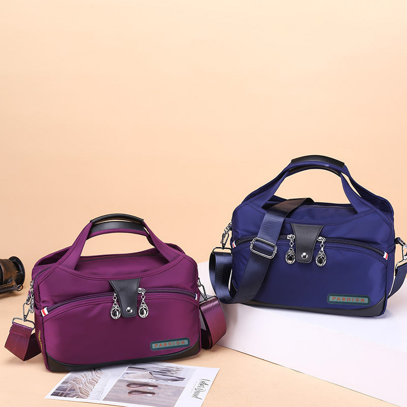 Two handbags, one purple and one blue, on a beige and white background.