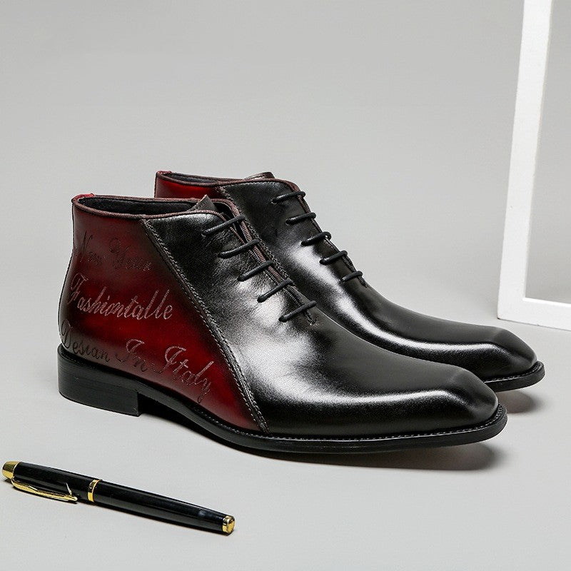 Pair of black leather dress shoes with red soles on a light gray surface, accompanied by a pen.